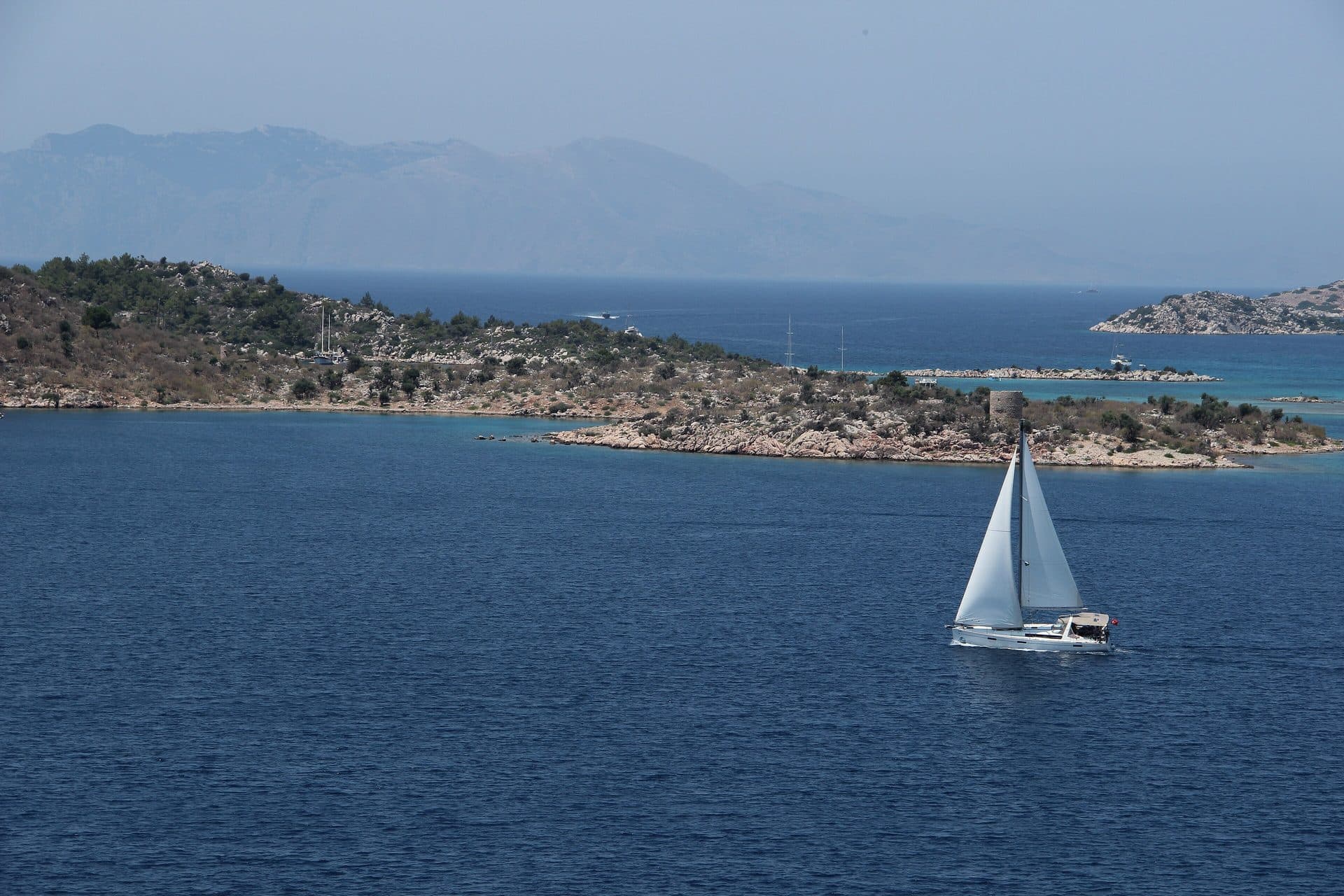 Sailing yacht passing in front of the islands off Bozburun