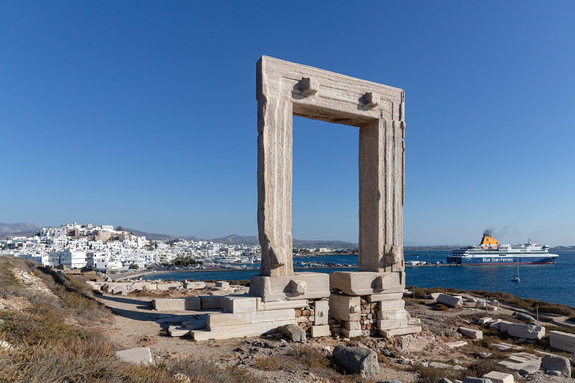 The Portara on Naxos with Chora behind it