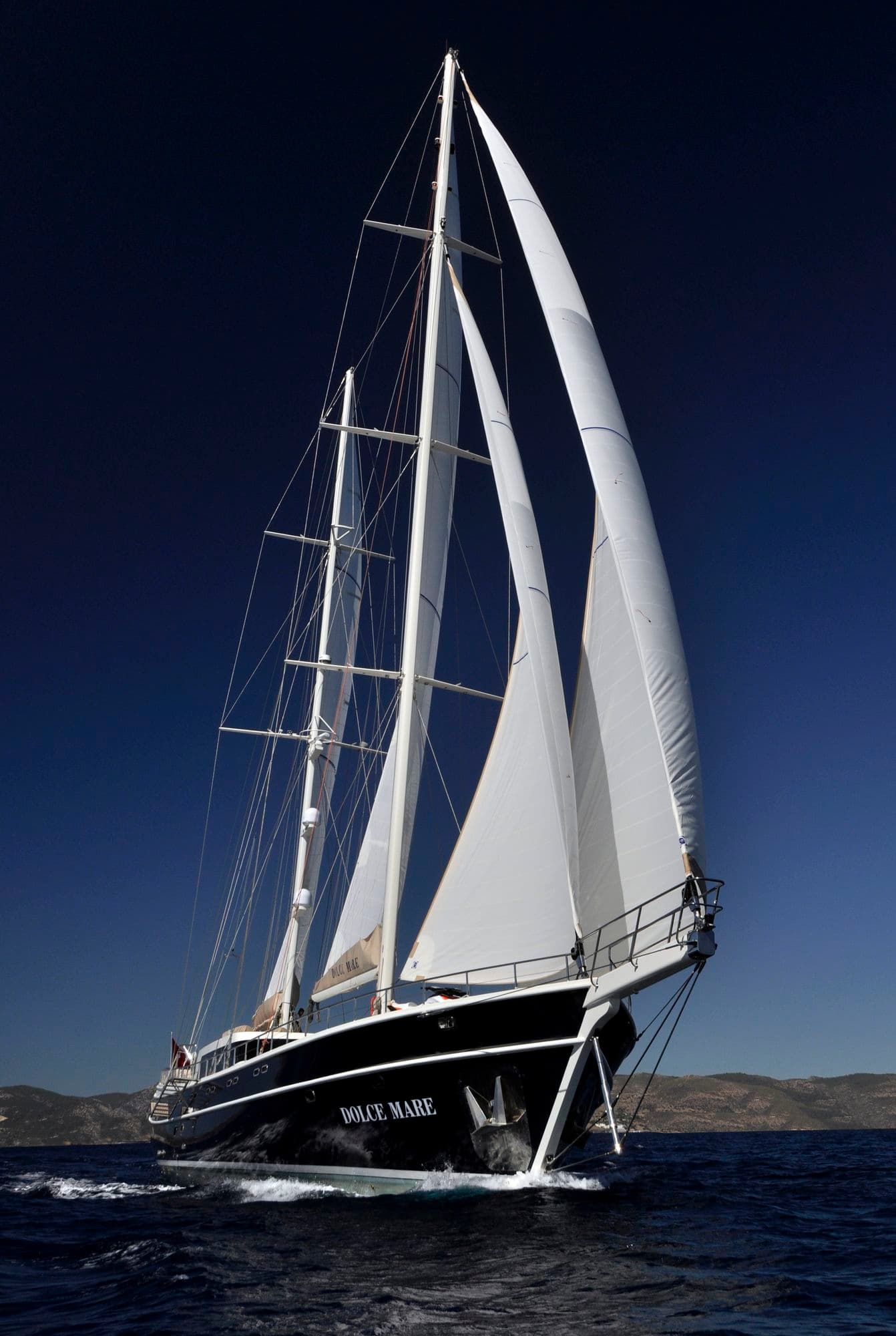 The sails of Dolce Mare seen from the bow