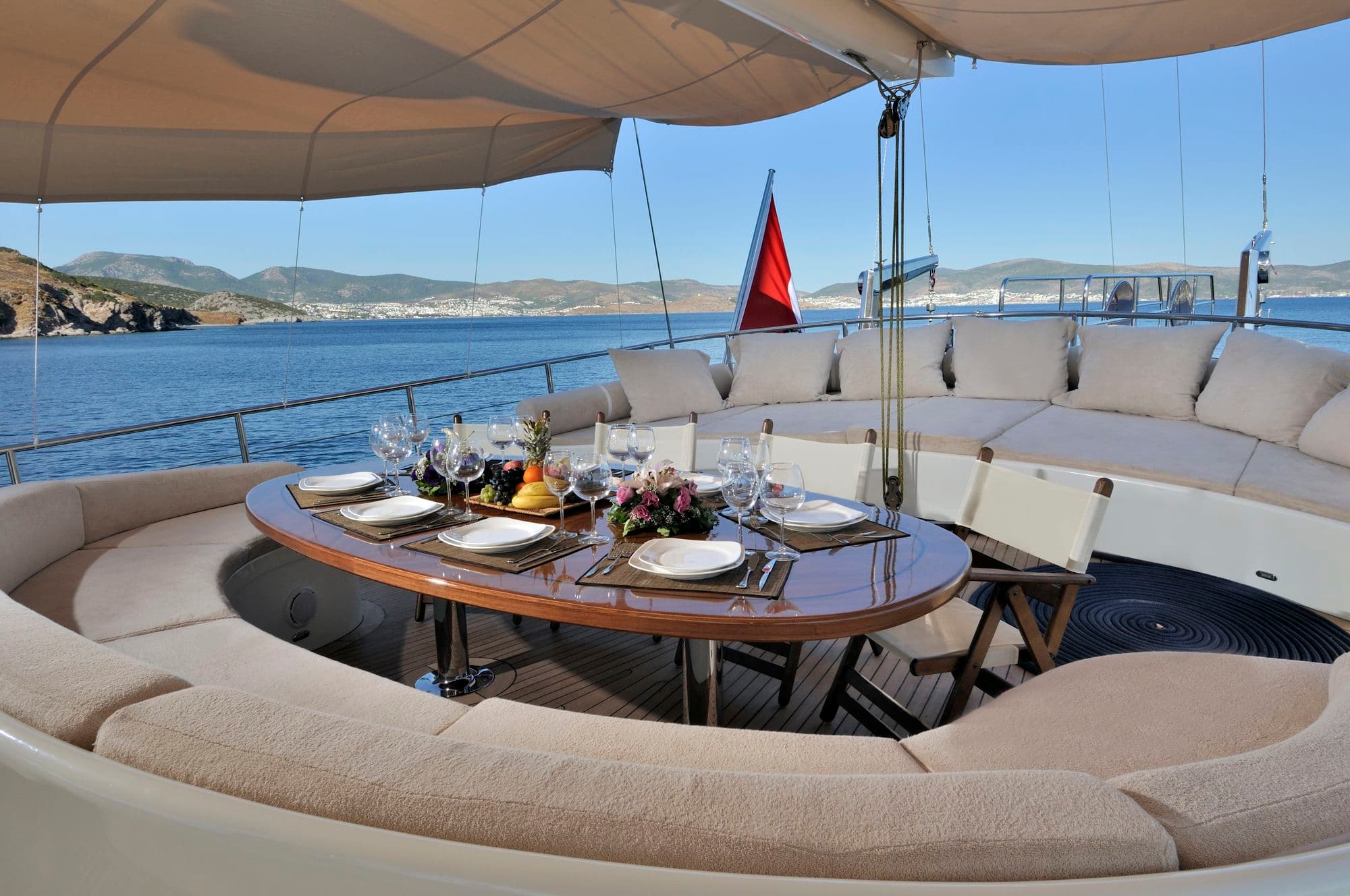 Cushioned dining area on the aft deck