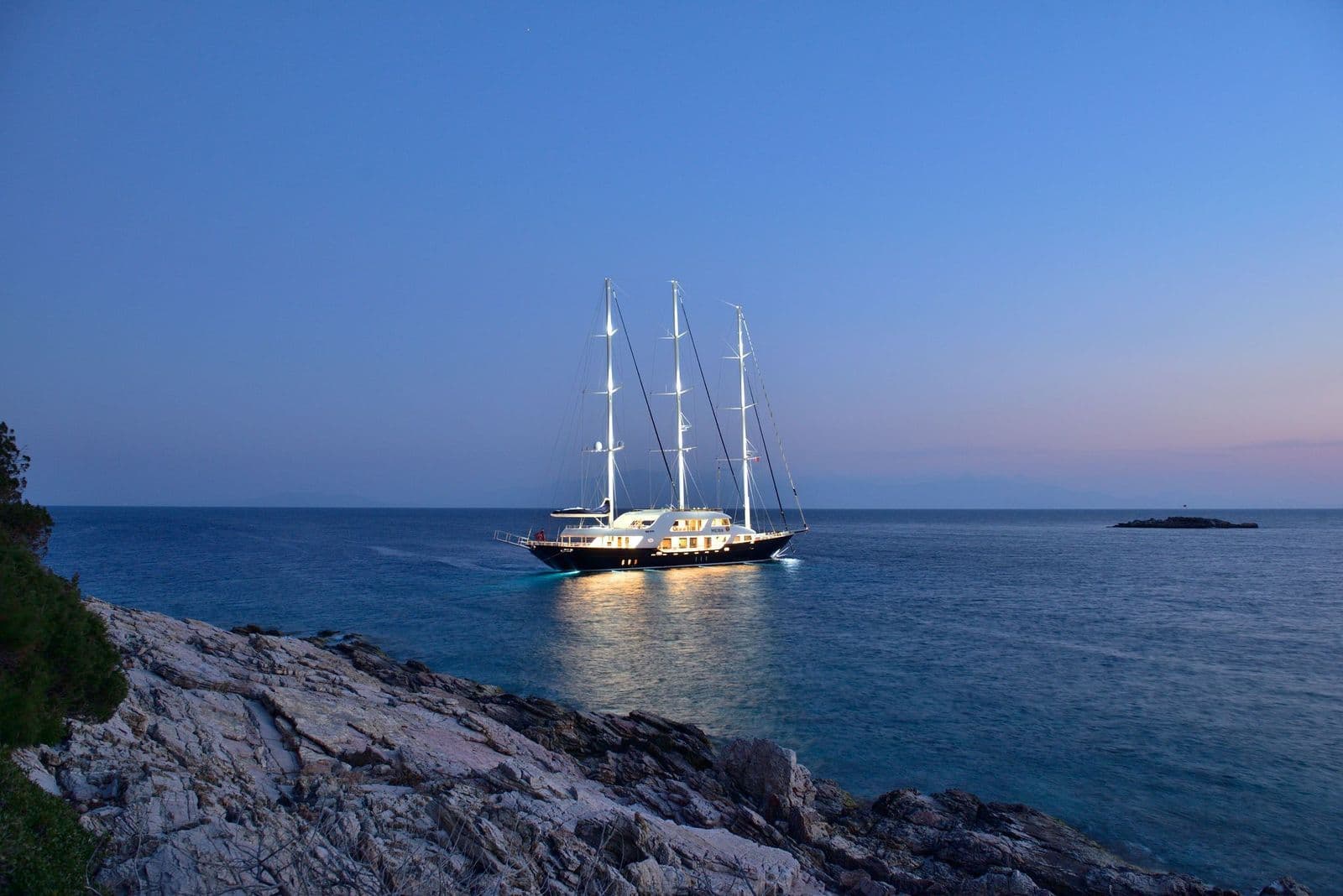 M/S MEIRA anchored in a bay at dusk