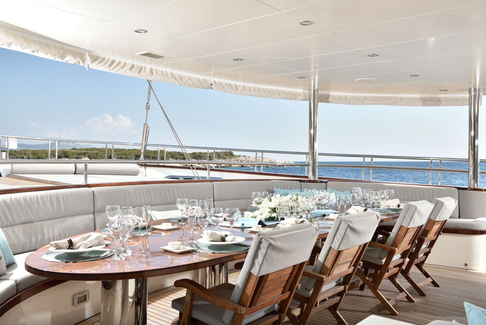 The oval dining table on the aft deck