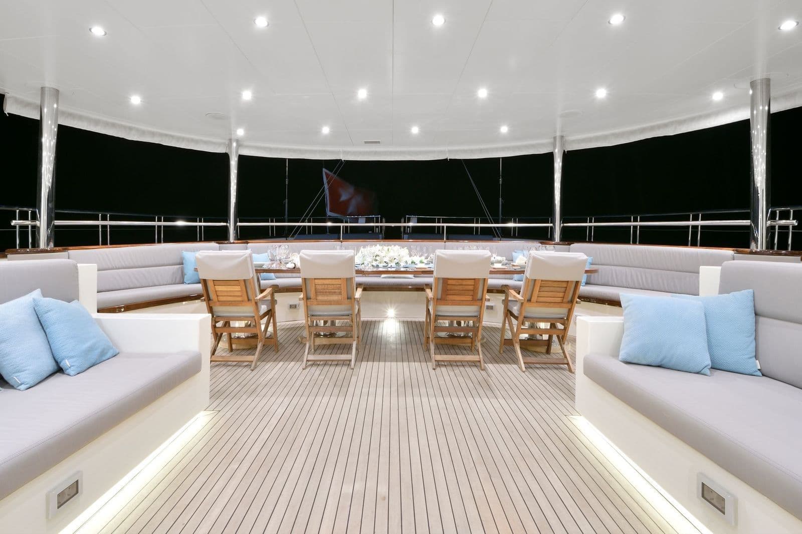 Aft deck seating area under the evening lights