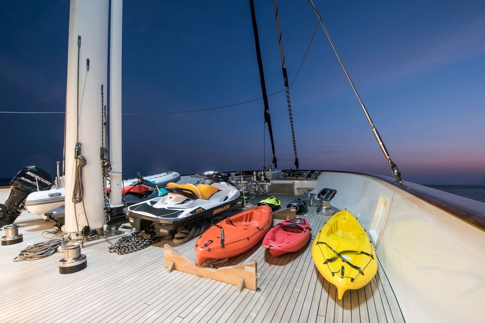 Canoe, jet ski and water toys on the foredeck