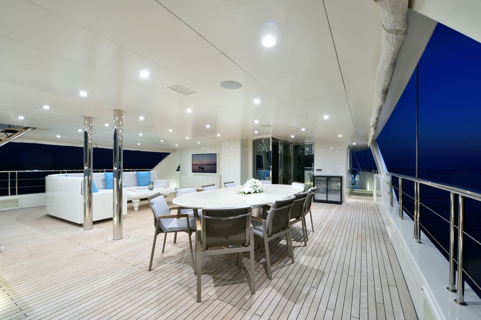 Dining and seating area on the upper deck by night