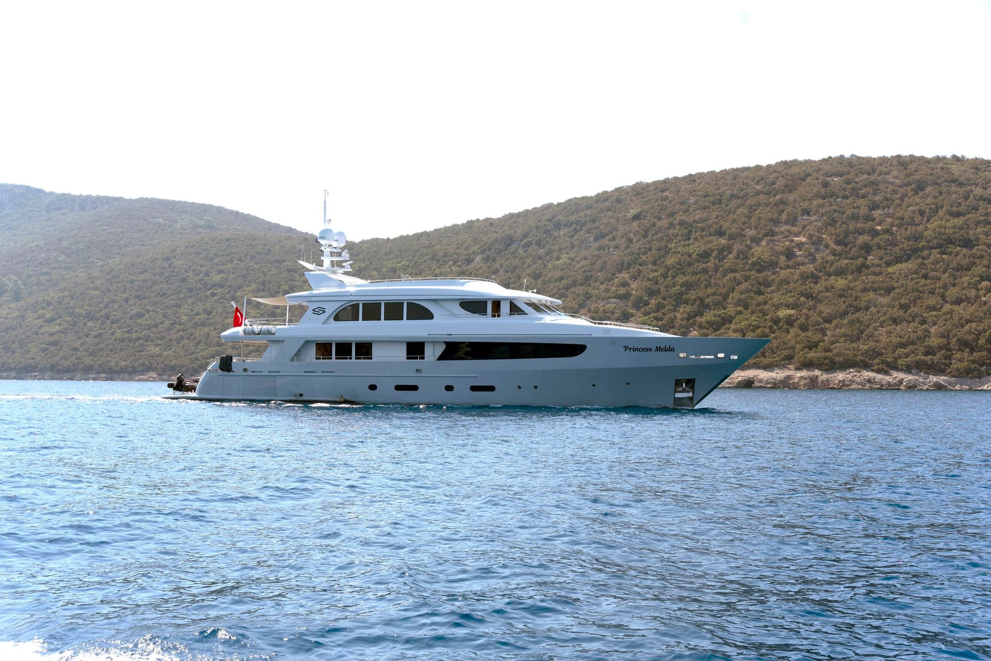 M/Y PRINCESS MELDA at anchor in front of a green bay