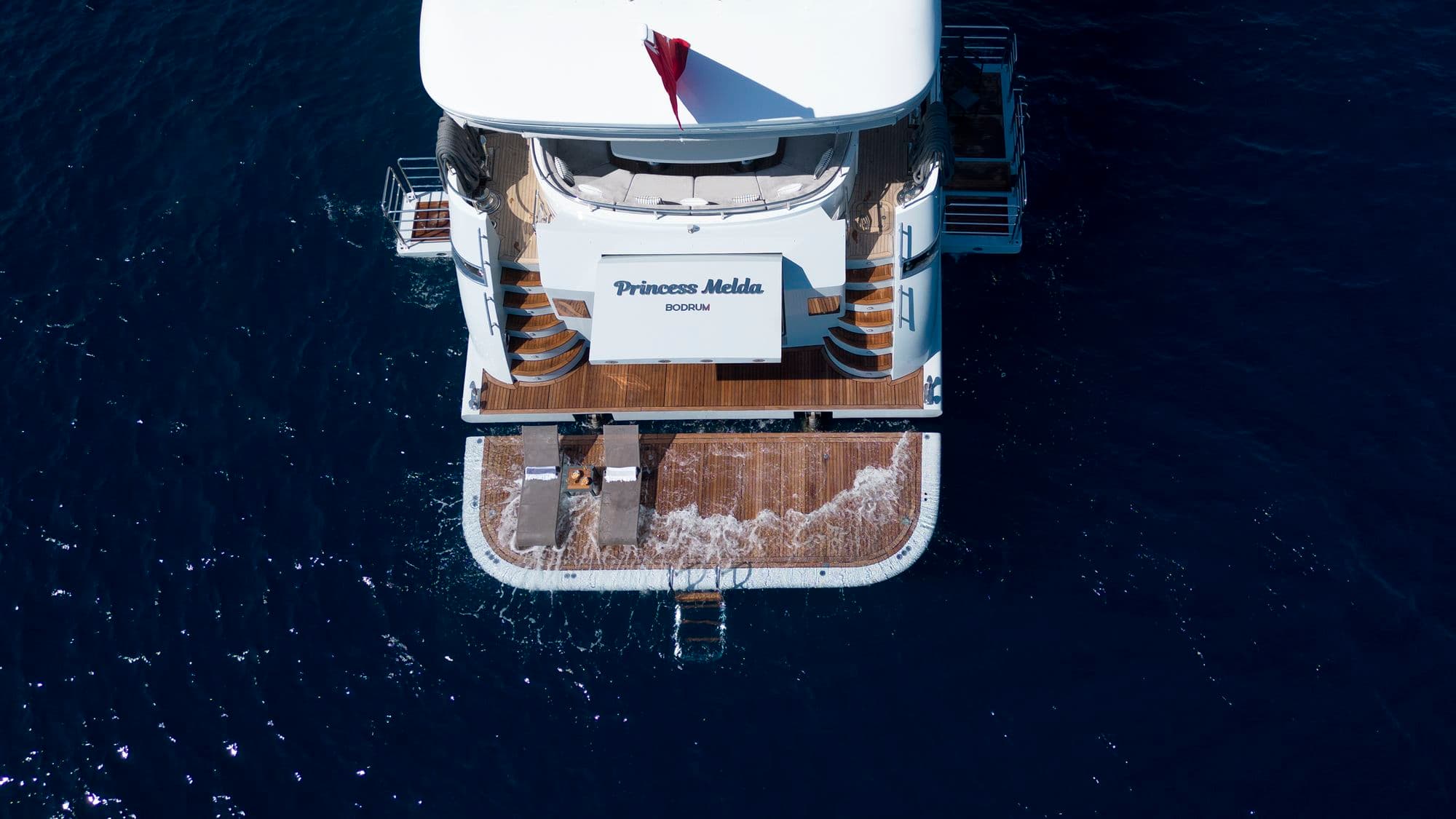 Bird's-eye view of the aft deck and swim platform of M/Y PRINCESS MELDA