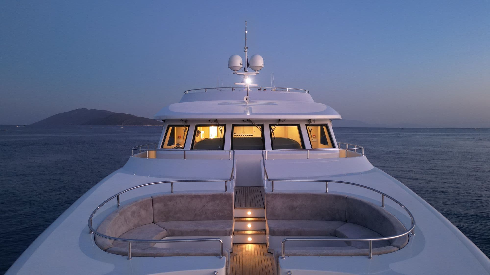 The foredeck and bridge of M/Y PRINCESS MELDA at dusk