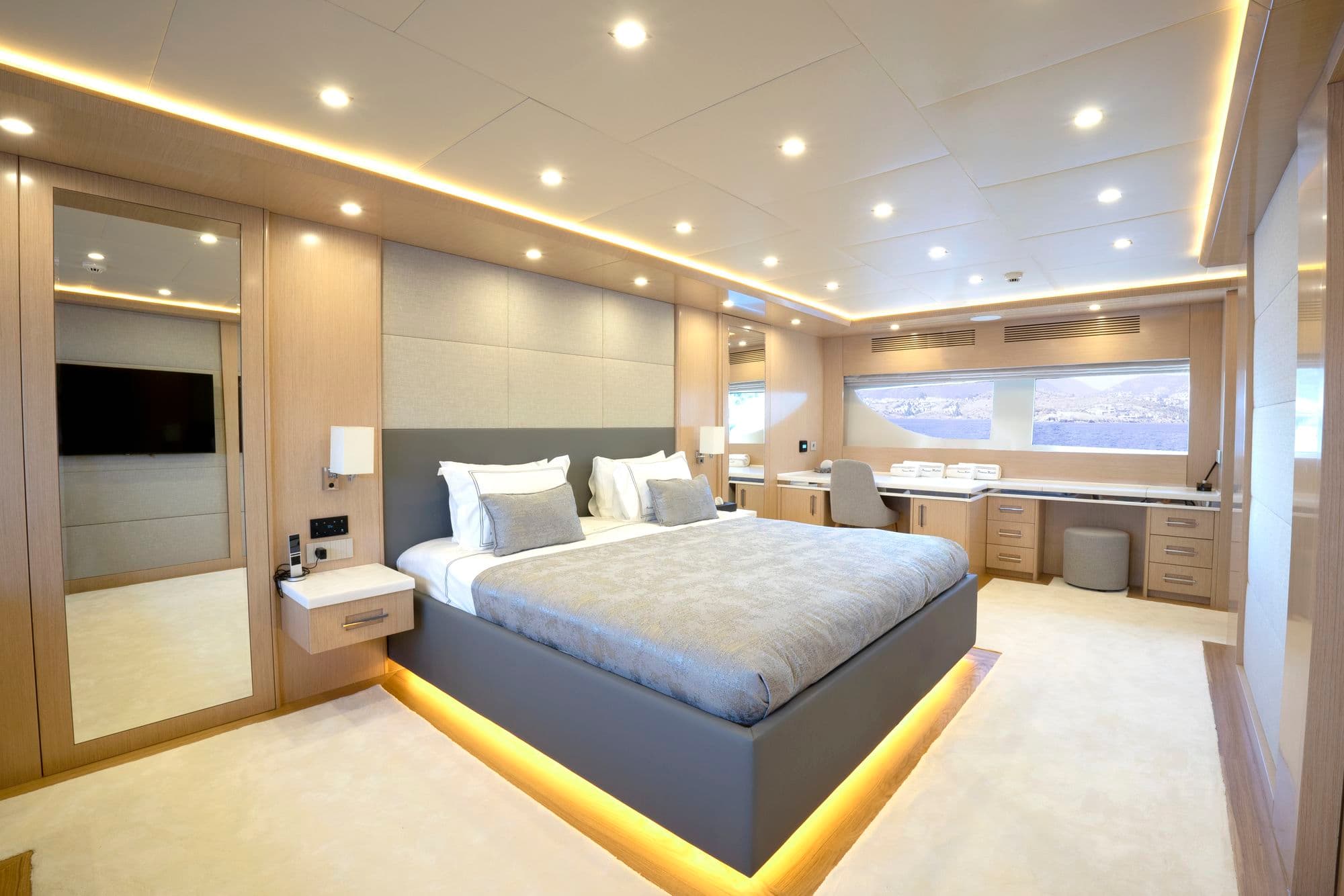 Bed and desk in the main deck master cabin