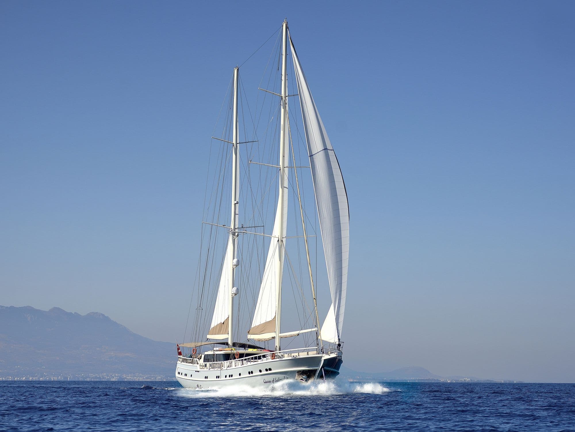 Queen of Salmakis with her sails filled