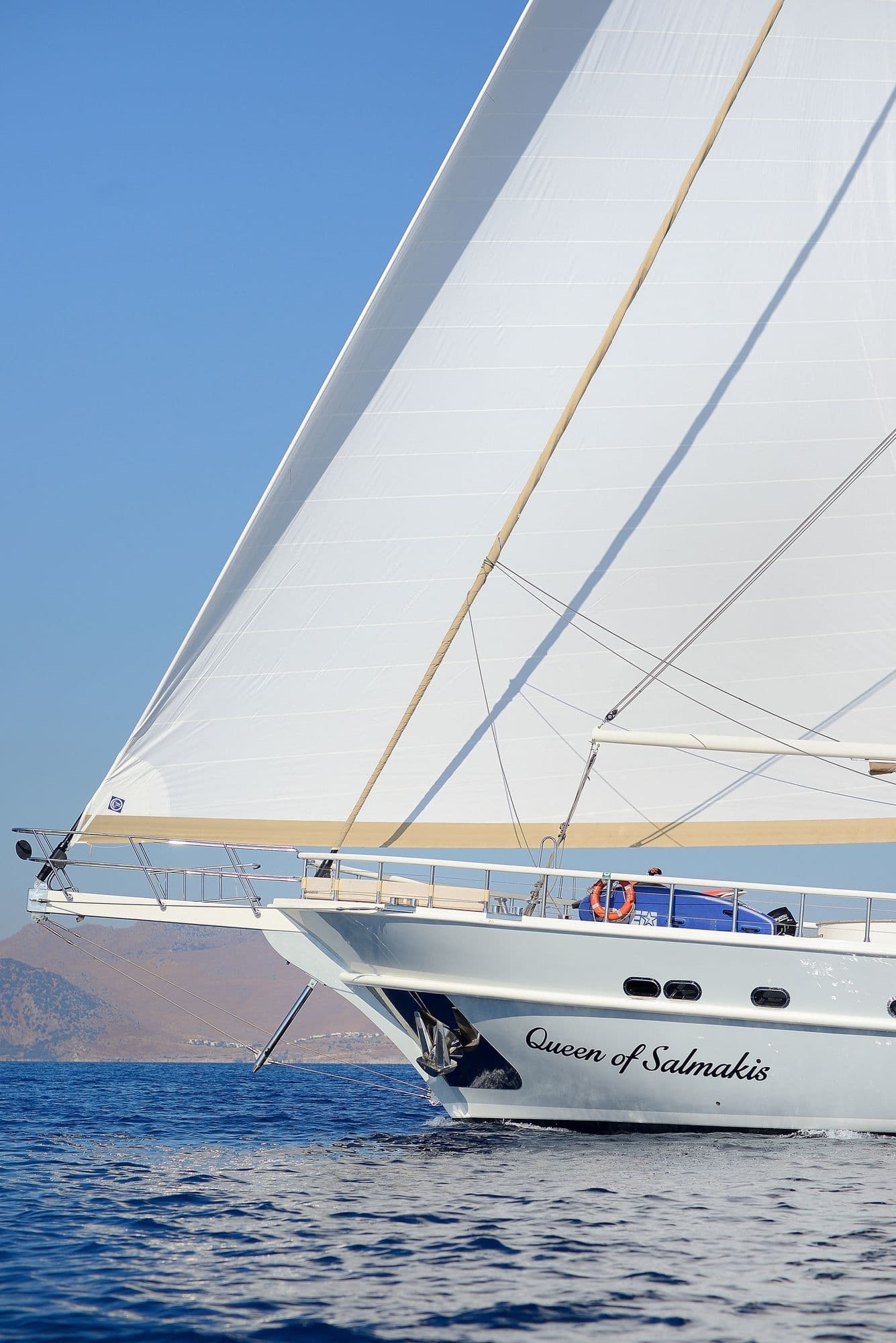 The bow and sails of Queen of Salmakis