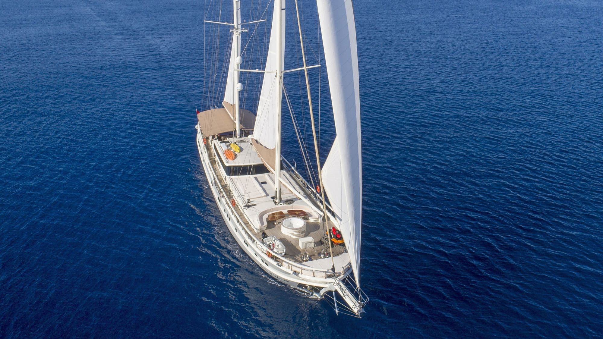 Queen of Salmakis on deep blue water, from the air