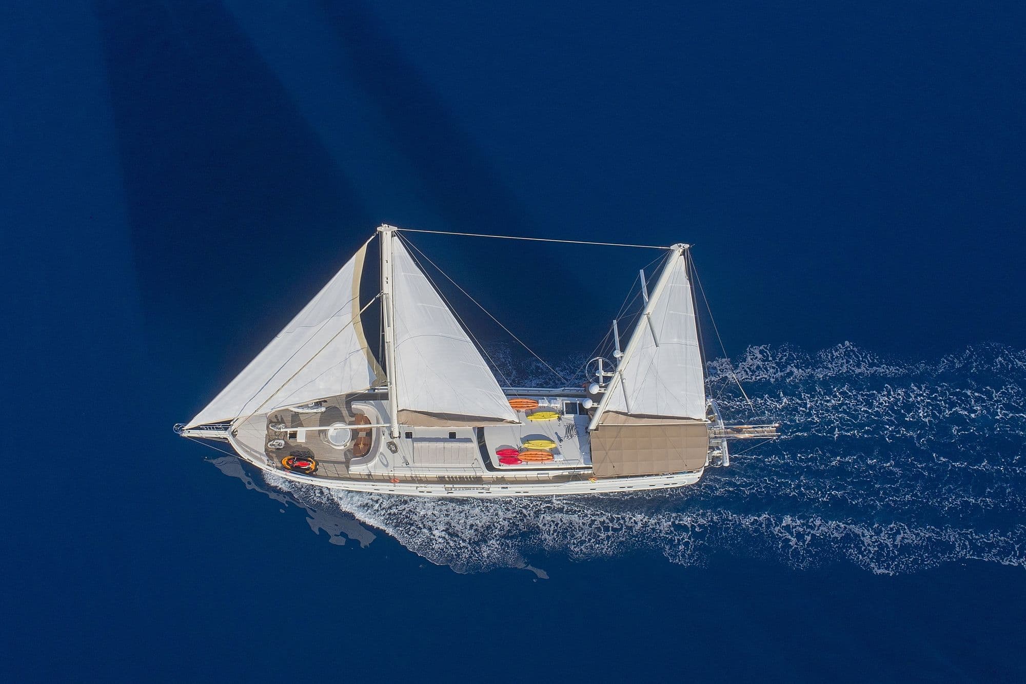 Queen of Salmakis sailing ahead, from the air