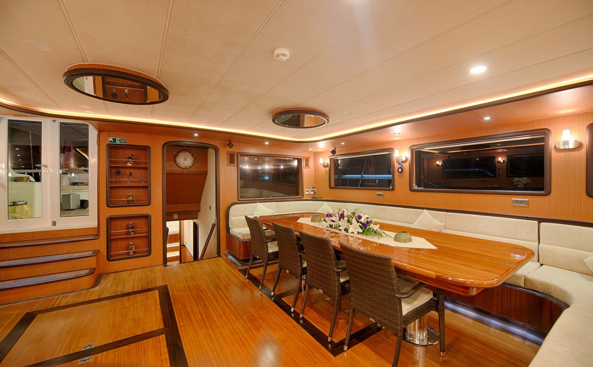 Dining table in the saloon and the stairs down to the lower deck