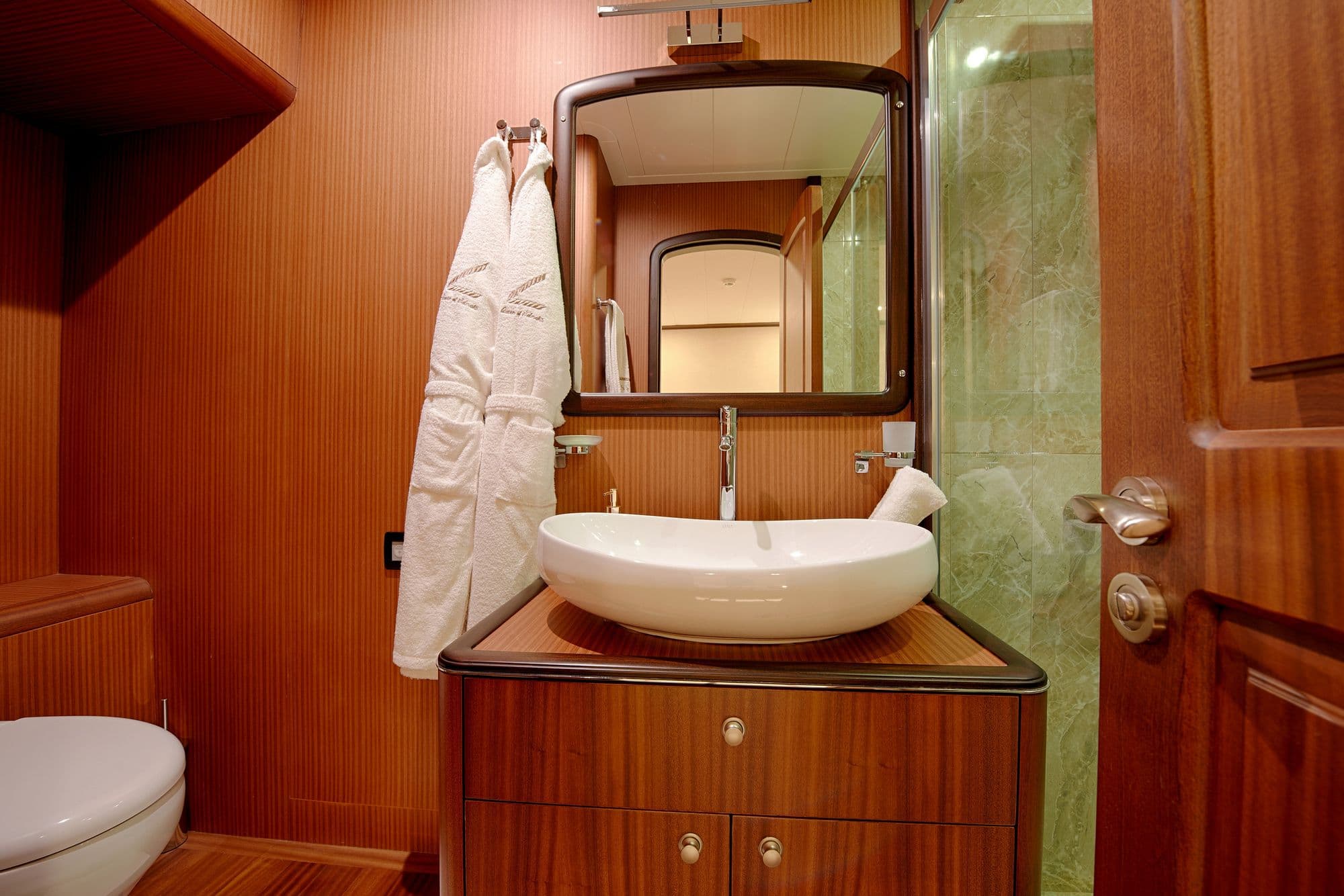 Washbasin and bathrobes in a cabin bathroom
