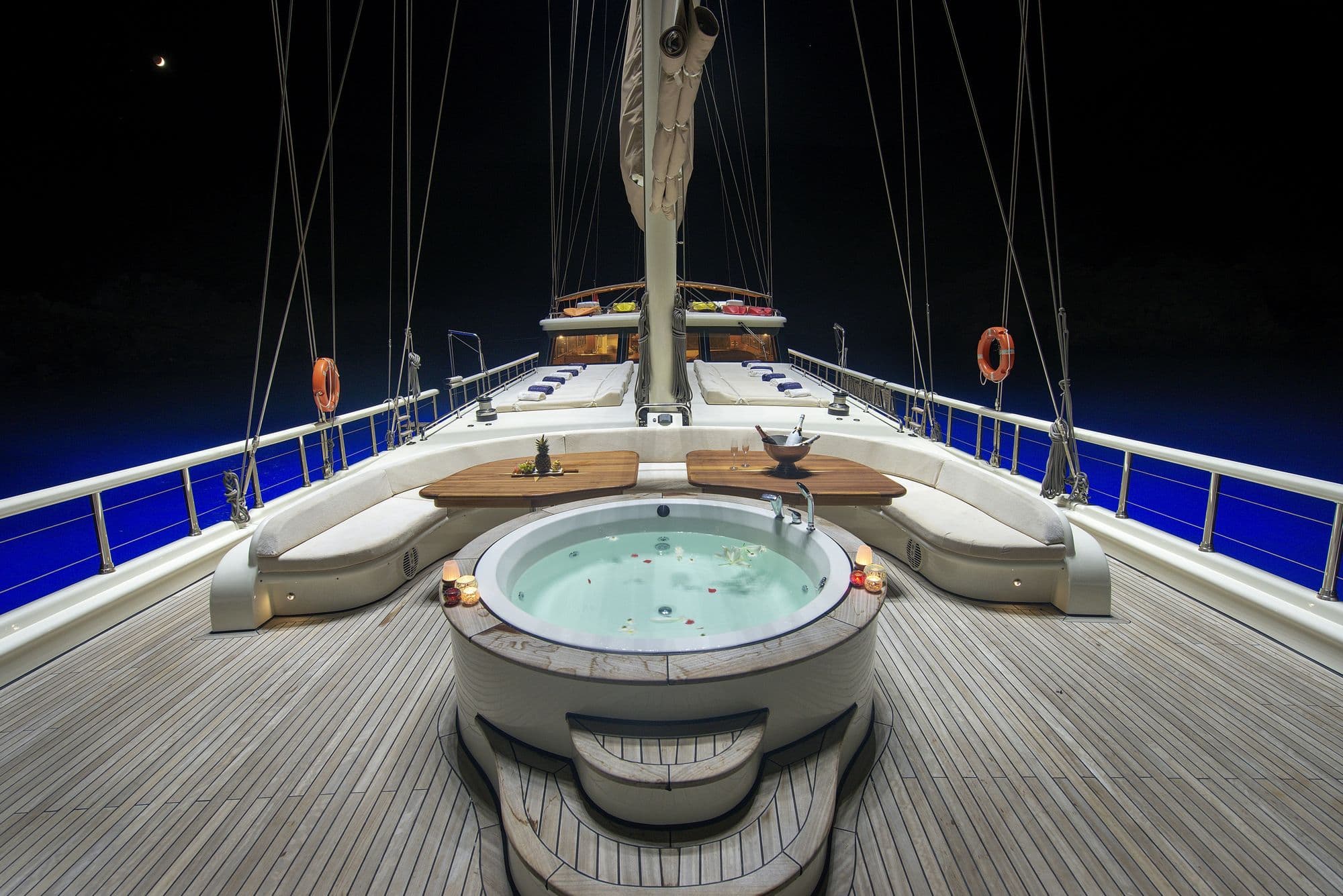 The foredeck jacuzzi illuminated at night