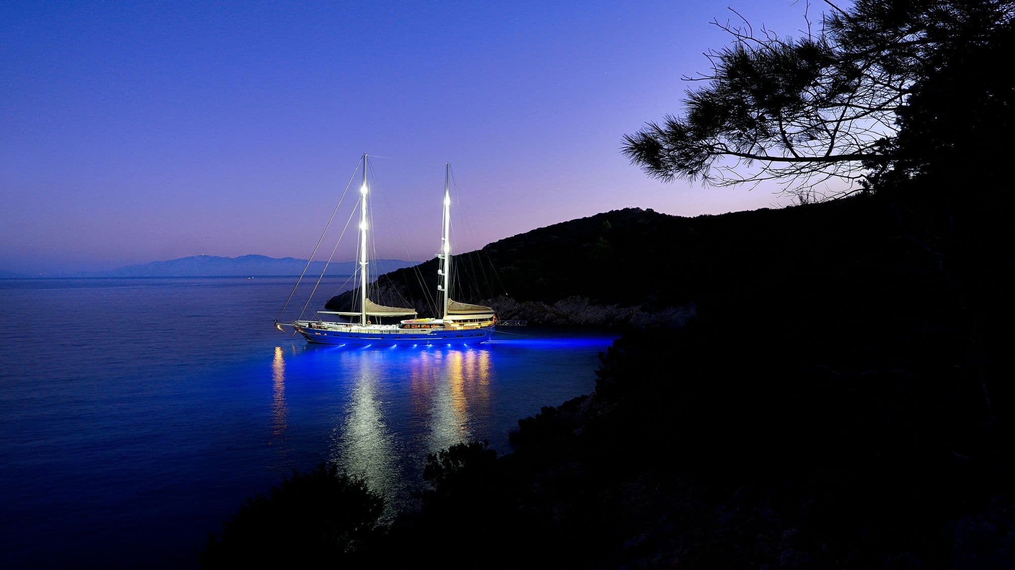 Queen of Salmakis in a bay after sunset