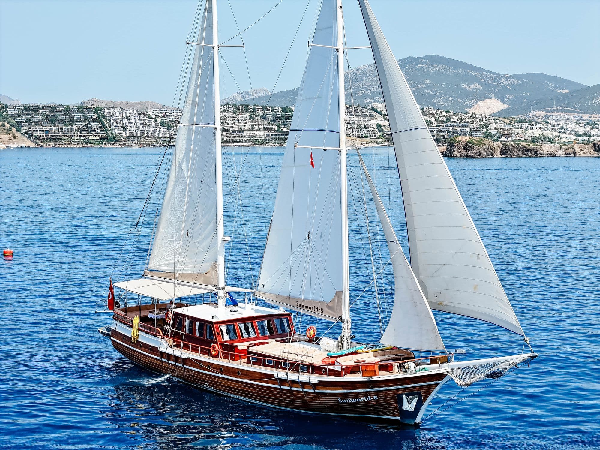 Sunworld-8 under way with her sails set