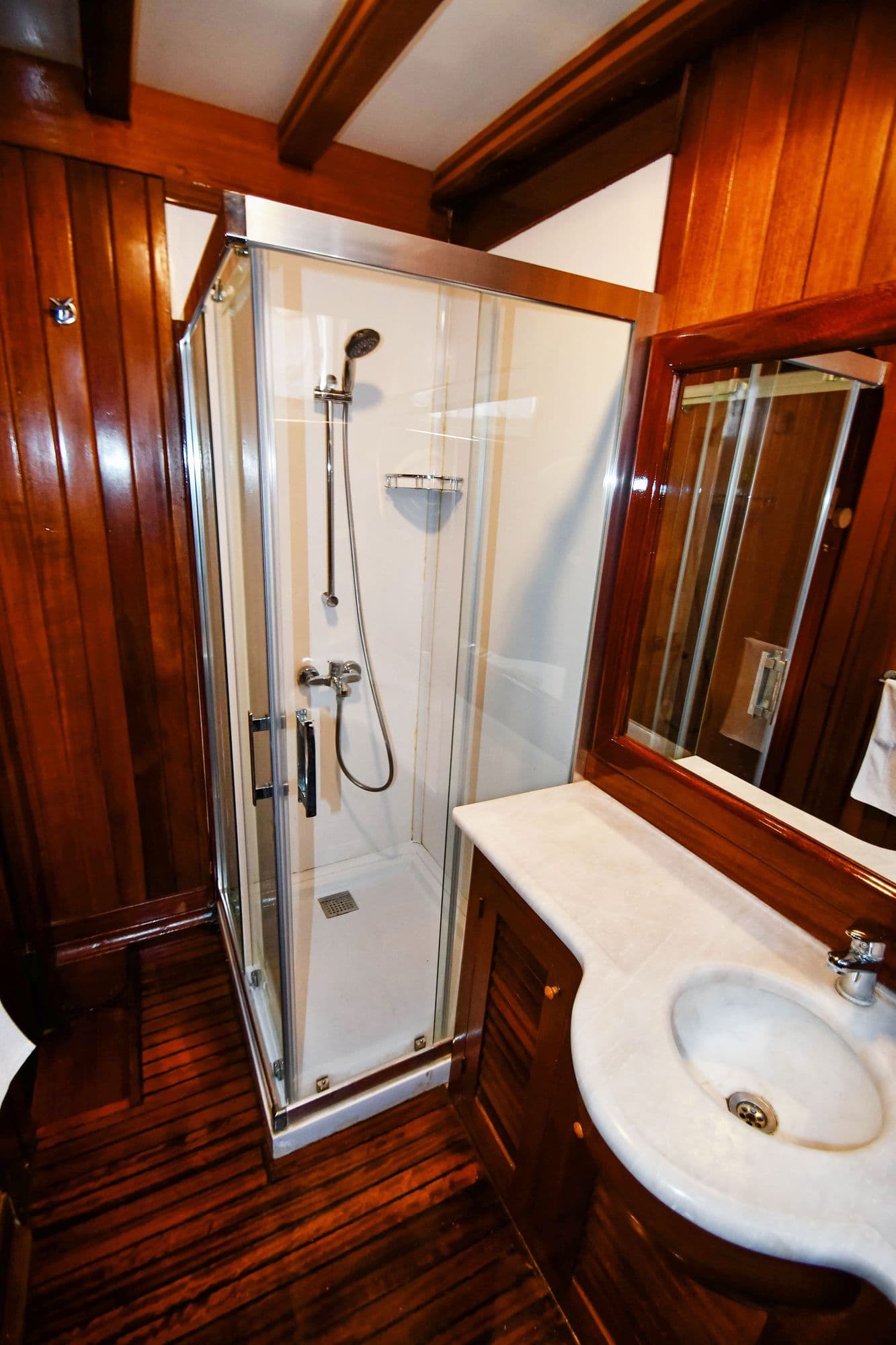 Washbasin and shower cubicle in a cabin bathroom
