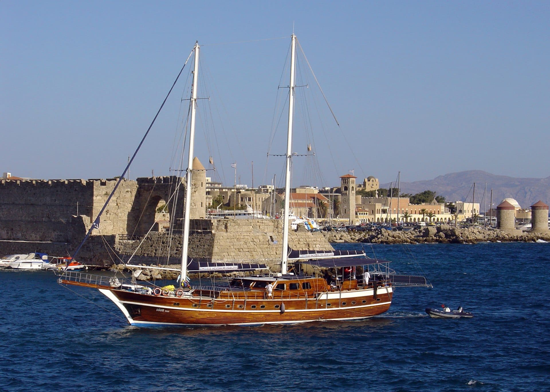 Gulet anchored in front of the medieval walls of Rhodes