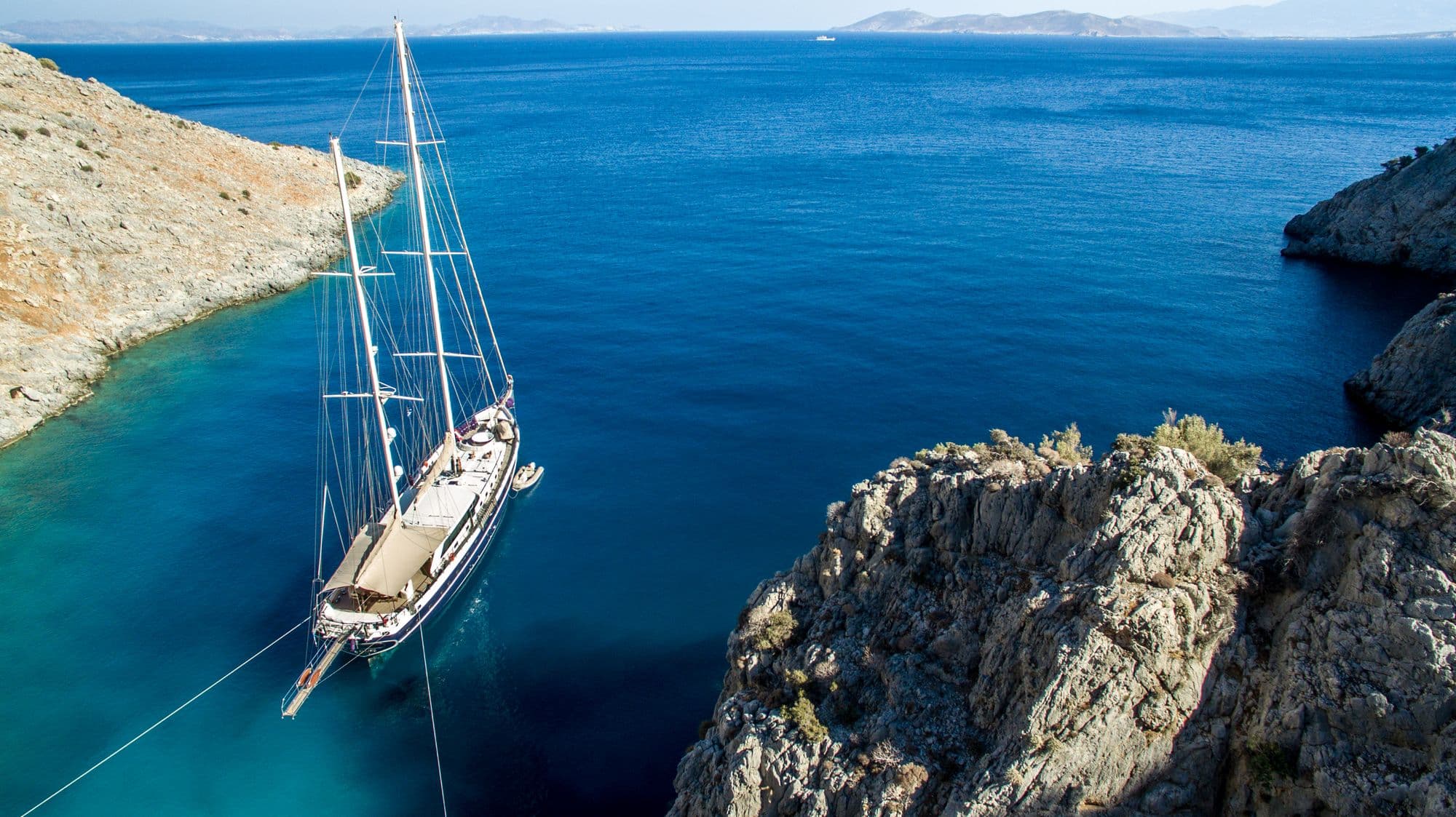 Dolce Mare at anchor in a turquoise bay